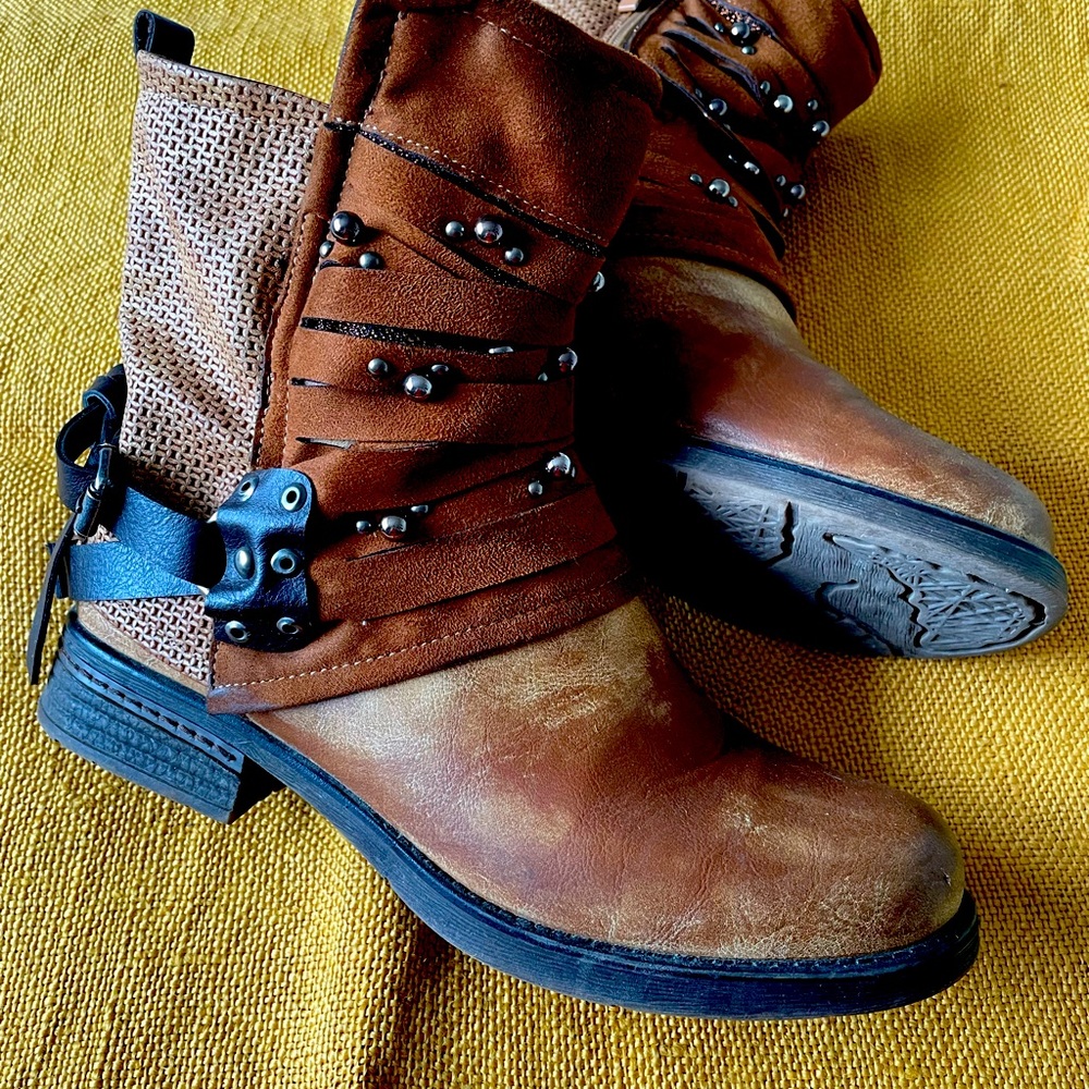 Tan pair of  distressed shirt boots. Size 40 but fits size 10.